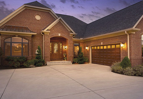front of house with modern entry and garage doors