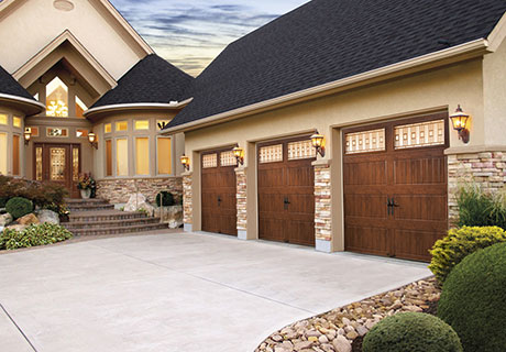 modern house with wooden garage doors