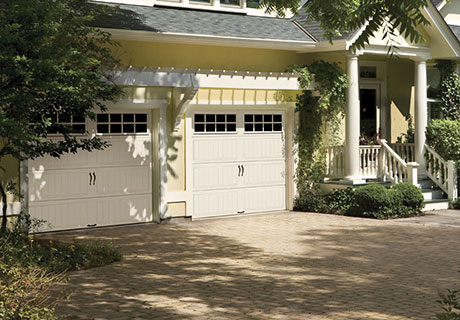 modern house with white garage doors