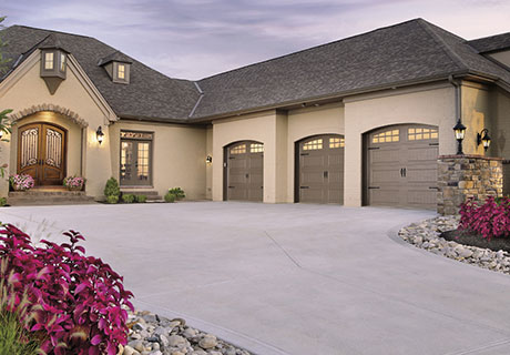 modern house with gray garage doors